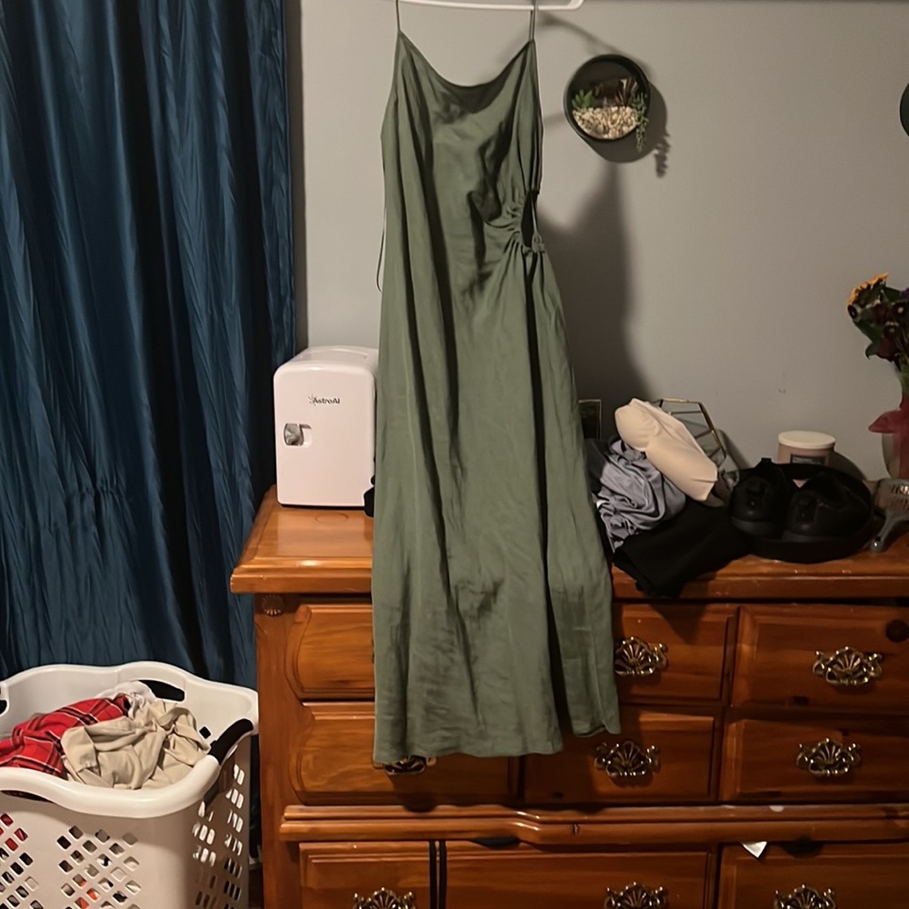 a dark green dress from zara that is long and has a cut out on the side, size m